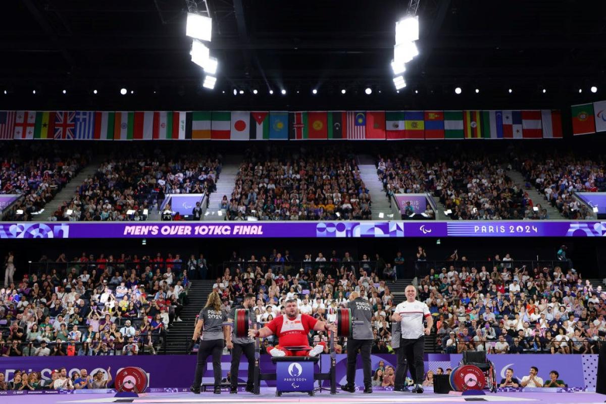 A packed arena watching a Para powerlifting competition